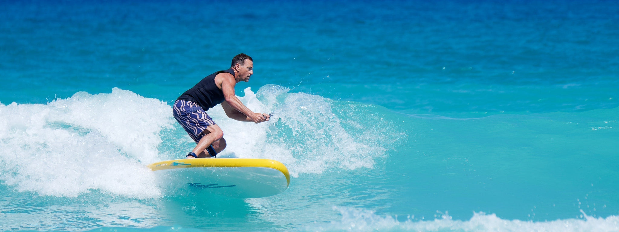 Surfing SUP in waves in off the coast