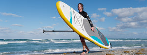 Surfing SUP near an ocean