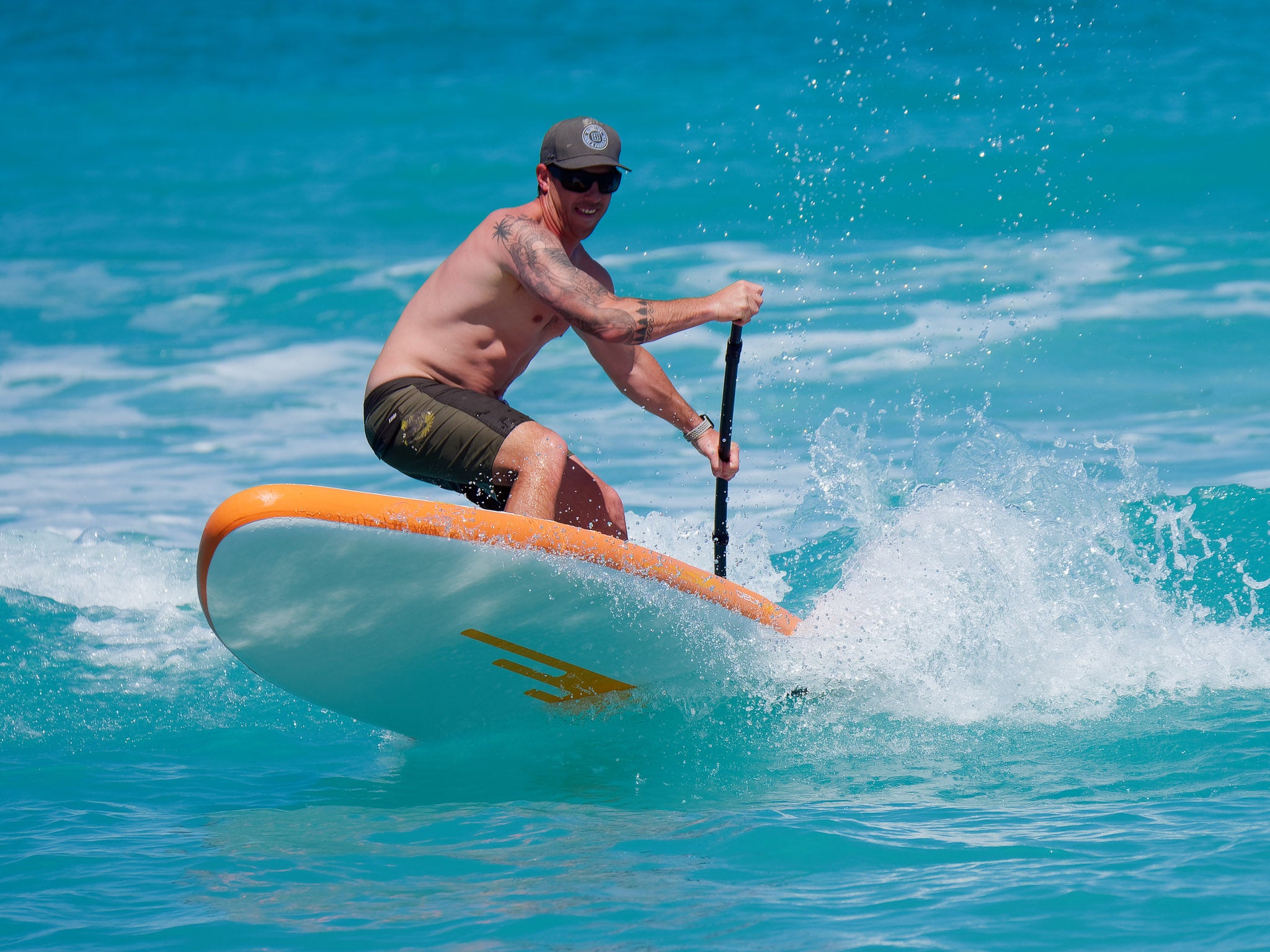 Performance Earth River SUP board in the Surf